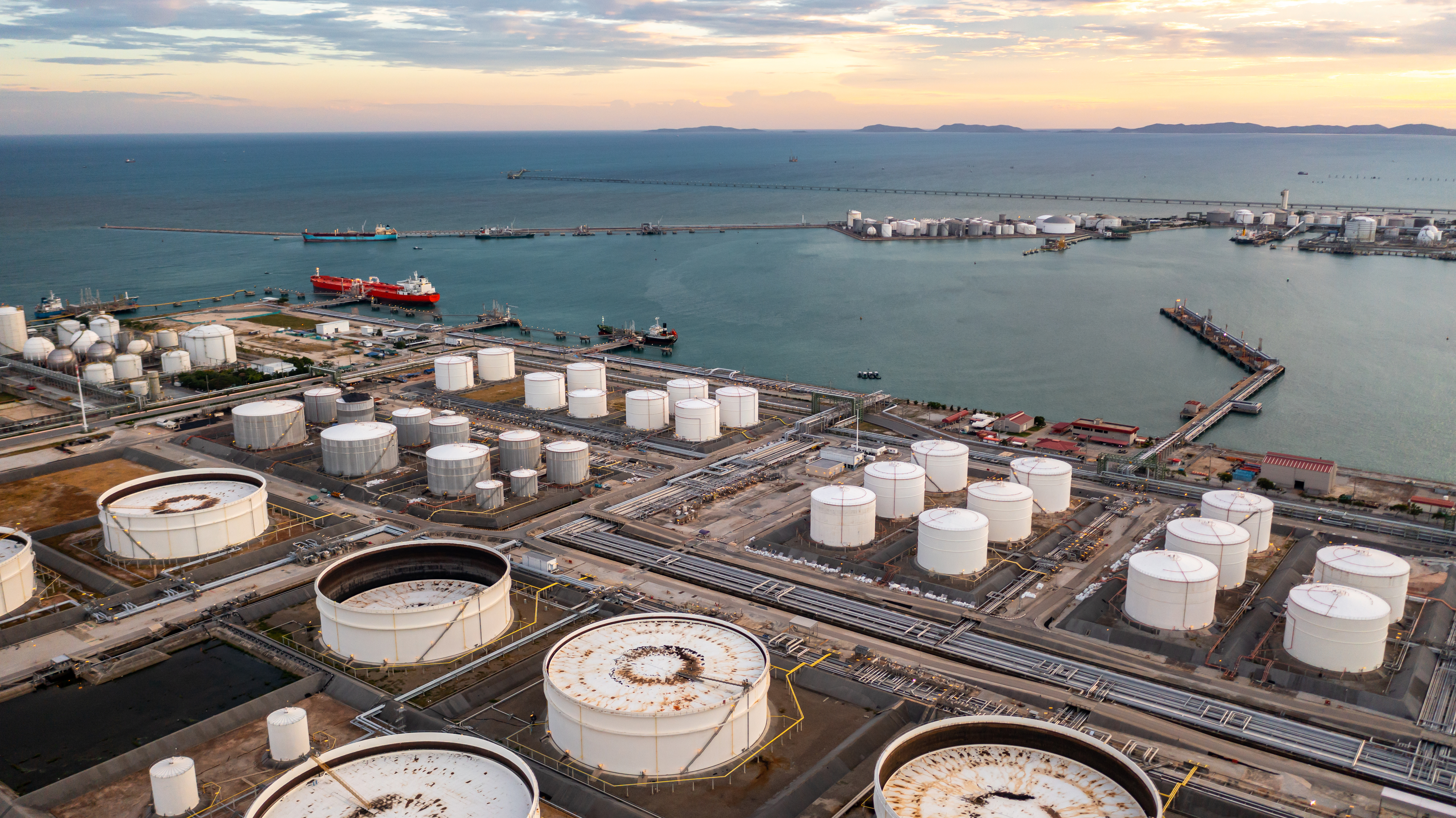 Aerial view of storage tanks and a coastal oil terminal